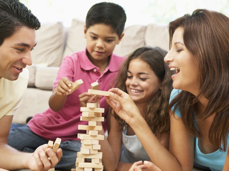 Family playing jenga