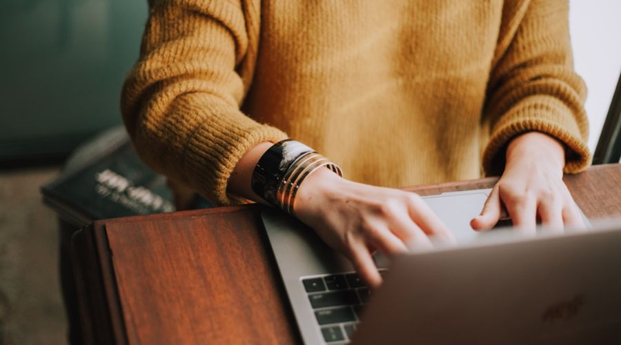 Woman working on laptop in the concept of Training Programs for Career Advancement