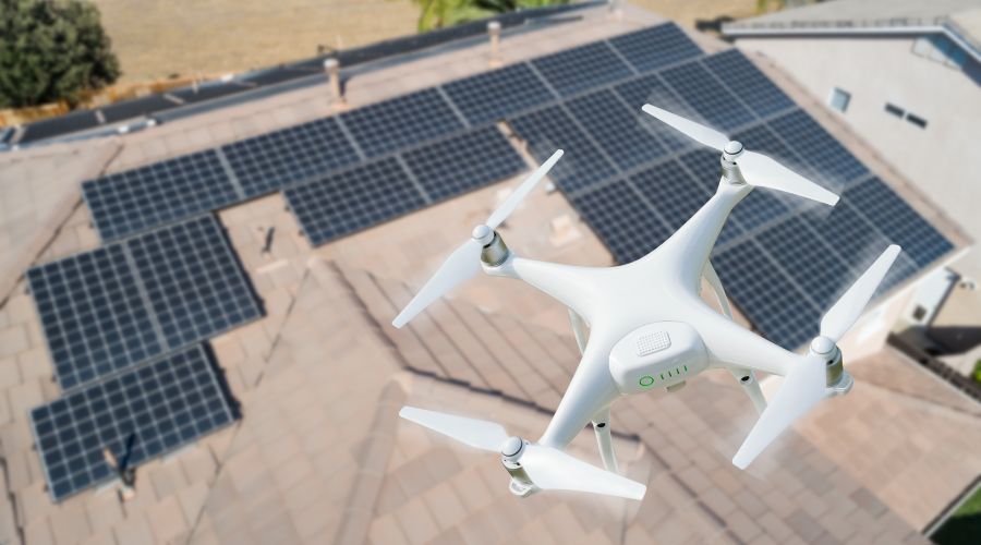 Drone carrying out roofing inspection