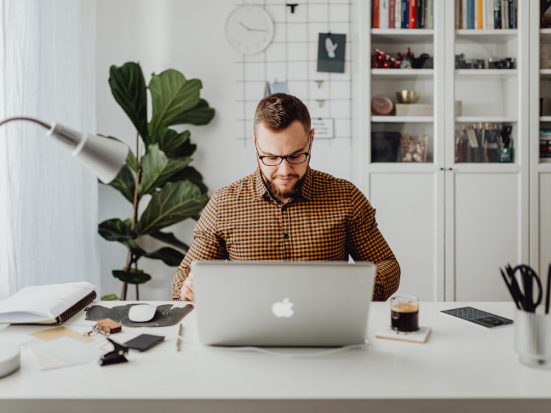 Man working on laptop in home office