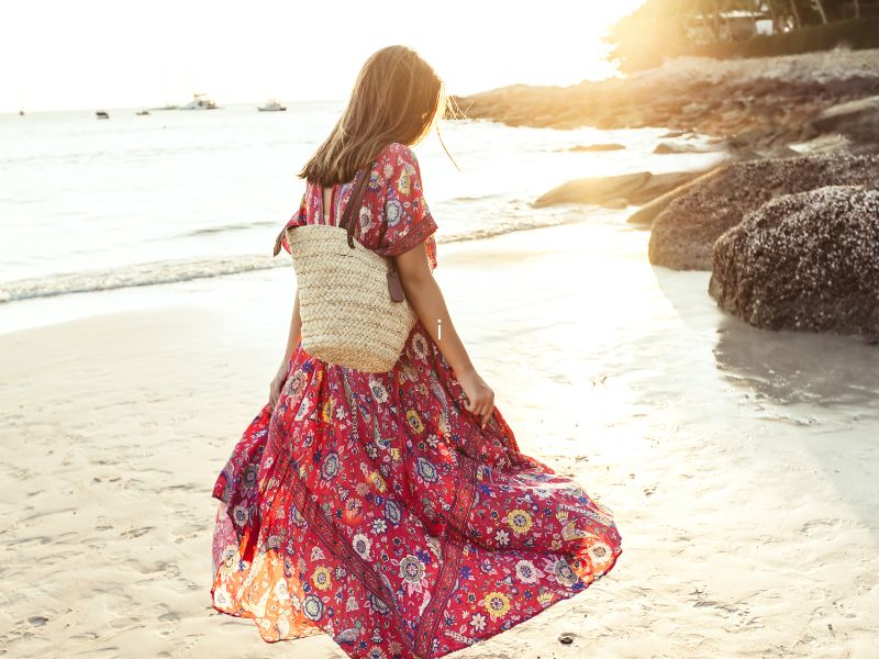 Woman in maxi dress on beach