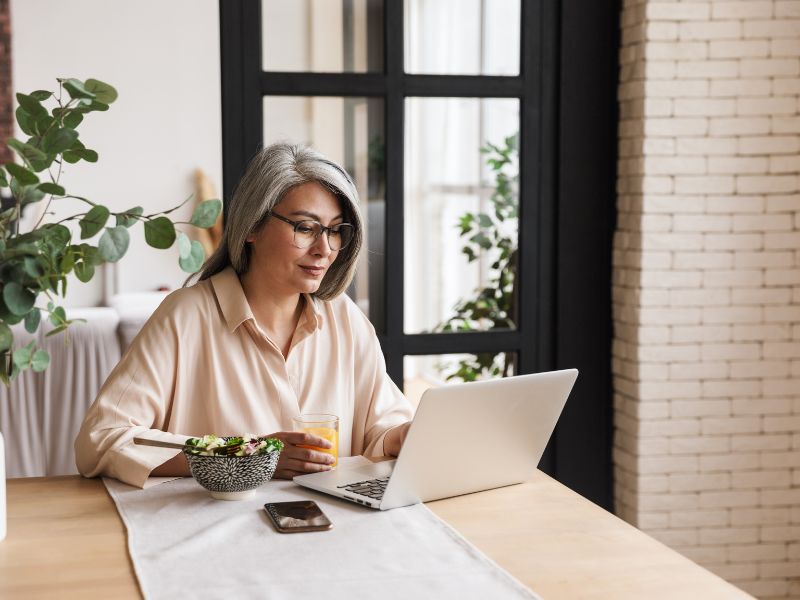 A woman on laptop using faxing software 