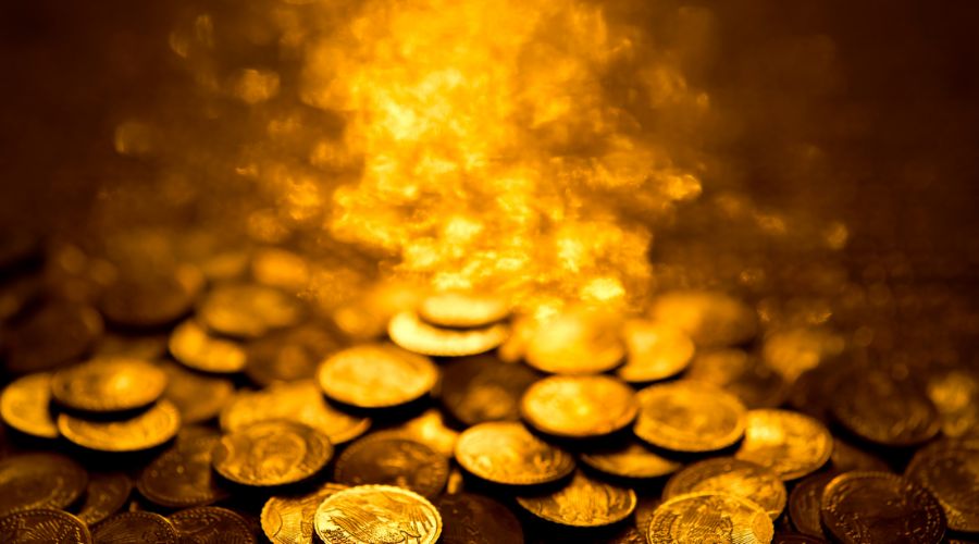 A pile of gold coins - Unlocking the Secrets of Jewelry & Coin: A Dazzling Blend of Beauty and Value