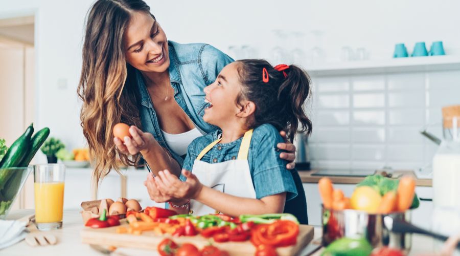 Mother and daughter cooking