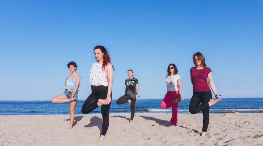 Yoga class on the beach is one of outvTips for Finding a Great Family Wellness Spa in Thailand