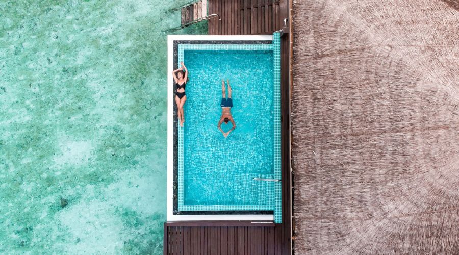 Couple relaxing in private pool