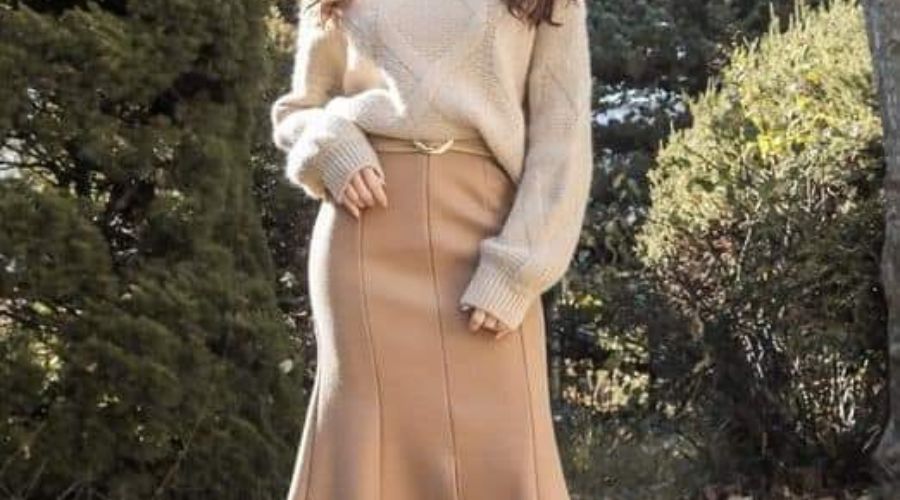 Woman wearing beige outfit 