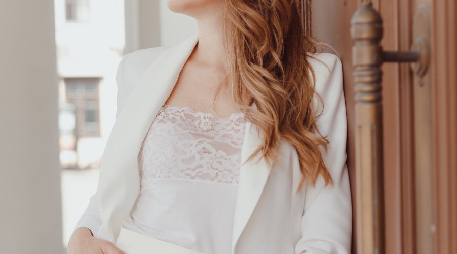 Elegant woman in cream blazer and camisole