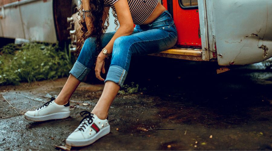 Woman in jeans and sneakers